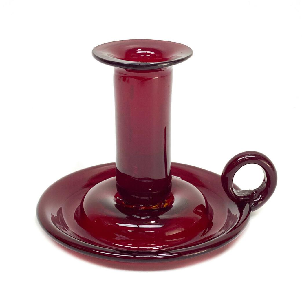 American Selenium Red Glass Chamberstick: American Selenium red glass chamberstick. The neck of the chamberstick is applied where it connects to the base. Polished pontil. Unmarked- possibly Steuben. Weight Approx., 0.5 lbs Measures Approx.,