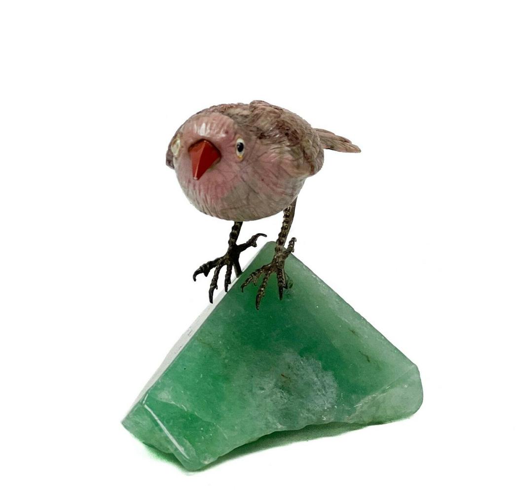 Vintage Carved Hard Stone Study of a Bird Figurine: Vintage carved hard stone study of a bird figurine. Bird carved of pink stone with silver feet and glass eyes, perched on a green fluorite base. Weight Approx., 110 total grams Measures Approx., 2.75 