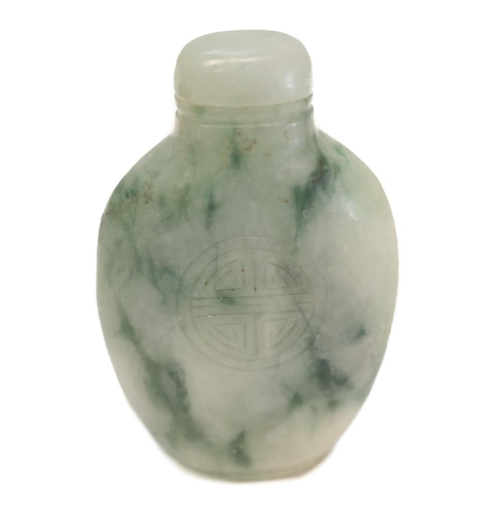 Chinese Jade Snuff Bottle: Chinese Jade Snuff Bottle. Hand carved character to both sides. Weight Approx., 50.2 grams. Measures Approx.,2.25 inches x 1.5 inches wide
