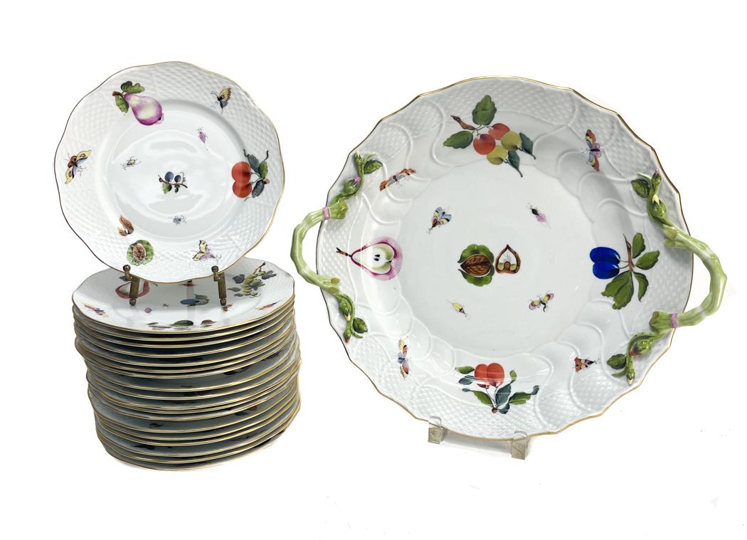 Herend Hungary Dessert Service for 18: Herend Hungary Hand Painted Porcelain Dessert Service for 18. Hand Painted fruits and butterflies throughout. Textured basketweave to the rim with a scalloped edge. Herend Hungary mark to the undersid
