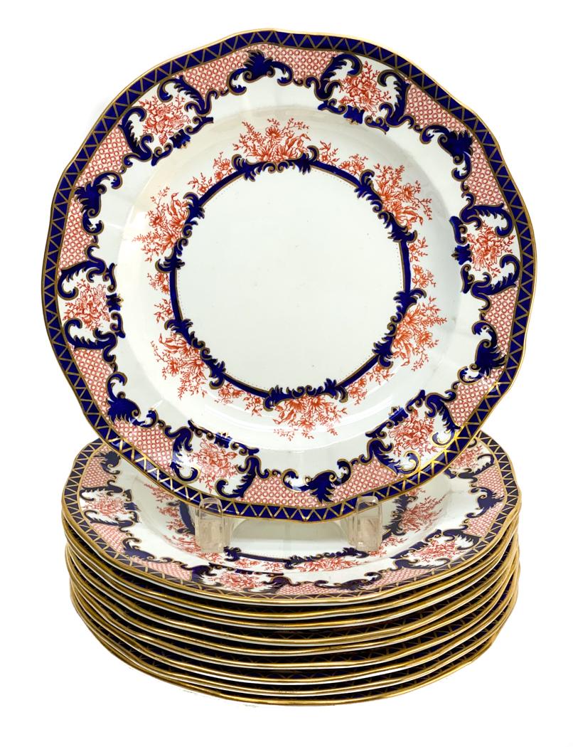 10 Royal Crown Derby Dinner Plates in Imari: 10 Royal Crown Derby Dinner Plates in Imari. Ivory ground with gold, cobalt and coral decorations. Royal Crown Derby mark to the underside base Weight Approx., 10 lbs Measures Approx., 10.4 inches dia