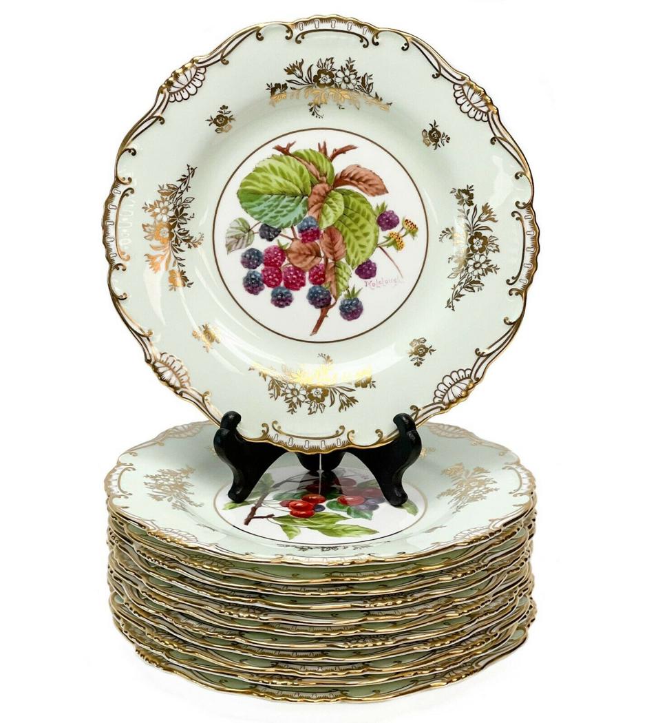 12 Minton England Hand Painted Porcelain Dessert Plates Fruit Signed c1920: 12 Minton England hand painted porcelain dessert plates, circa 1920. A light green ground to the edge with gilt floral decoration and gilt to the scalloped rim. Each plate features a hand painted imag