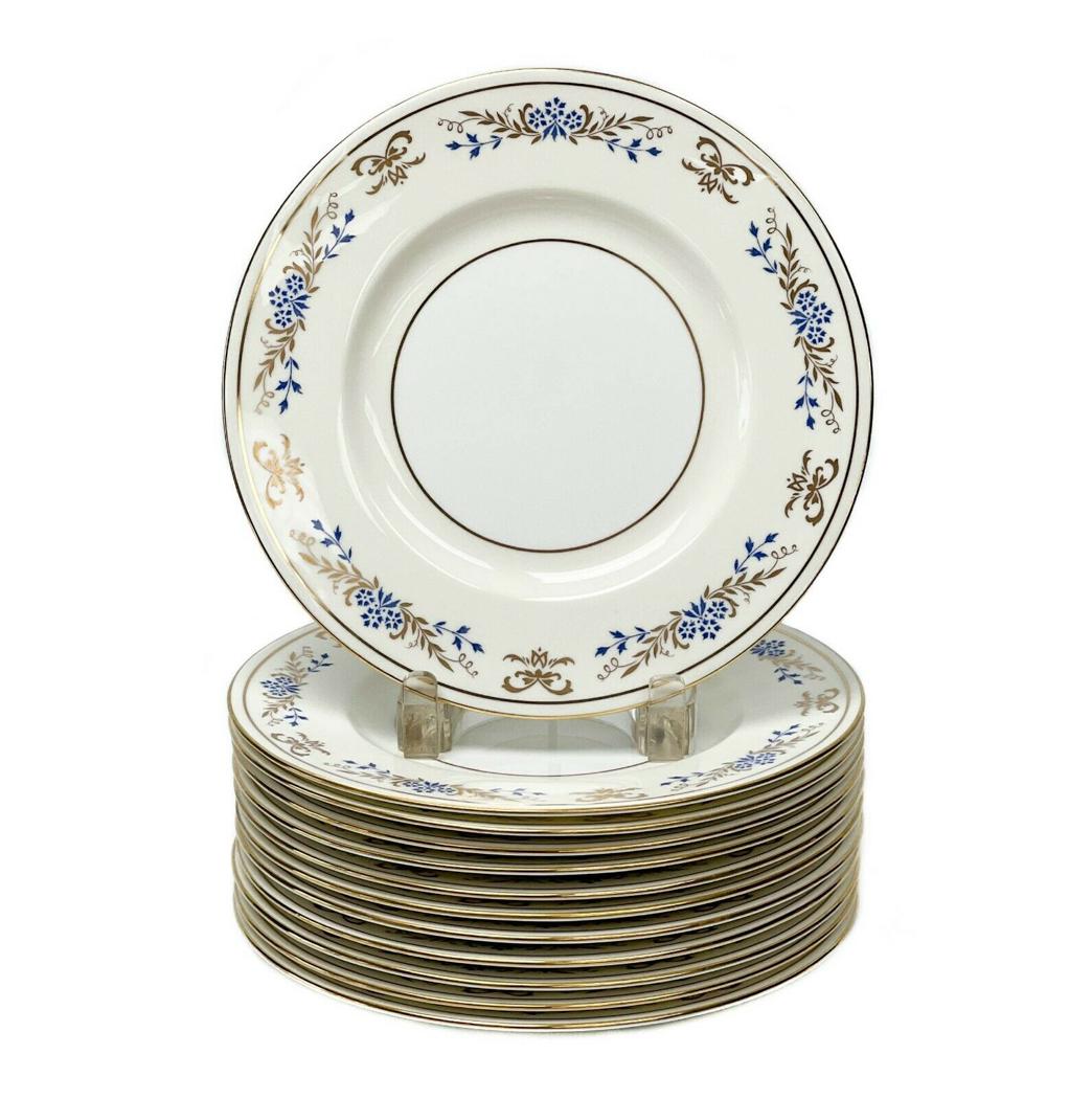 12 Minton England Hand Painted Porcelain Dessert Plates in X519, circa 1930: 12 Minton England hand painted porcelain dessert plates in X519, circa 1930. White to the center, an off-white ground to the edge with blue and gilt foliate and floral decoration. Gilt to the rim. Min