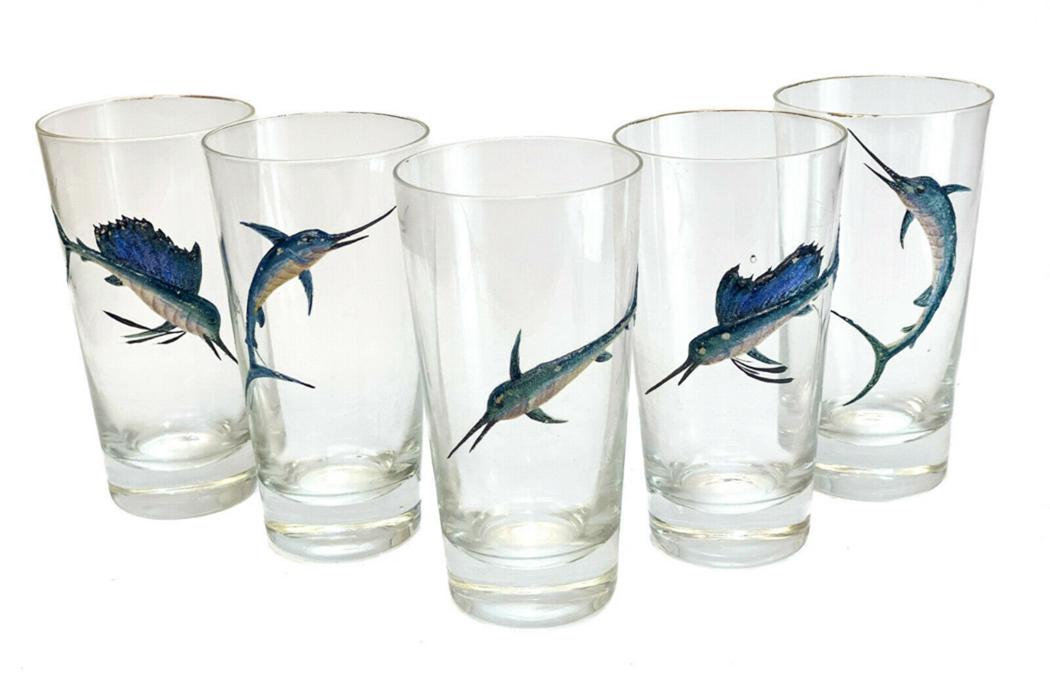 5 American Glass Enamel Swordfish Tumbler Goblets: 5 American glass & blue hand painted raised enamel swordfish tall tumbler goblets. Gilt to the top rims. Weight Approx., 5 lbs Measures Approx., 3.25 inches diameter x 6 inches tall Domestic Shipping: