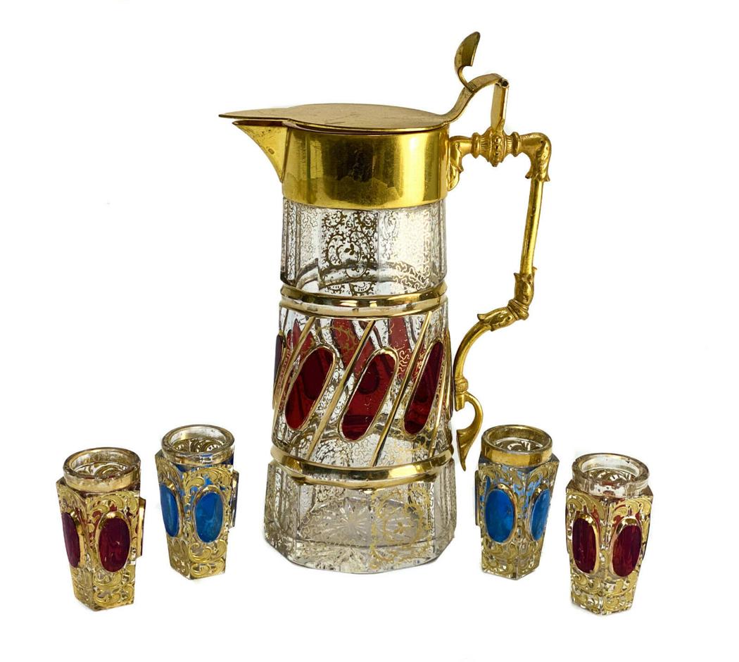 Moser Cut Glass Gilt & Applied Garnet Red & Sapphire Blue Pitcher & Goblets: Moser cut glass gilt & applied garnet red & sapphire blue pitcher and goblets. Gilt swirls throughout the boyd of the pitcher and goblets. Applied garnet red panels to the pitcher and to two goblets. 