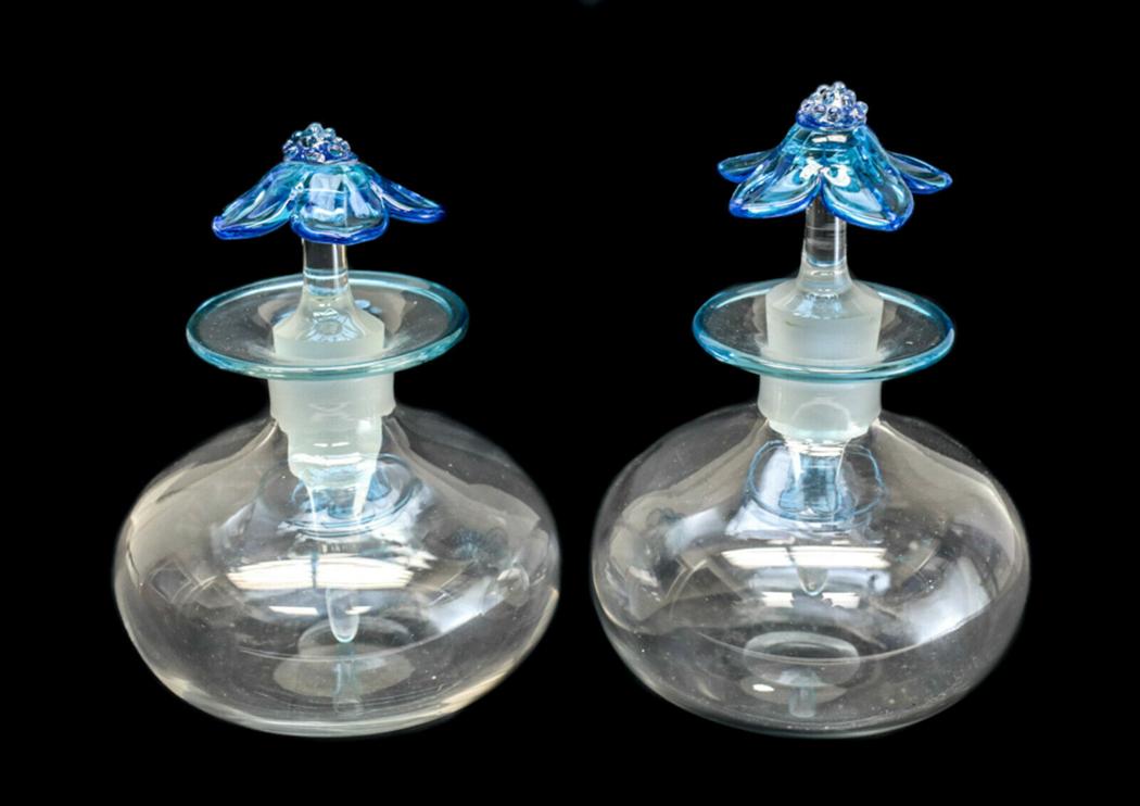 Pair Steuben Cologne Bottle Celeste Blue Cintra Lip: Pair Steuben art glass cologne / perfume bottle Celeste Blue Cintra Lip Wrap Flower Form Stopper #3404. Bulbous form in colorless features a beautiful Celeste Blue Cintra lip wrap and matching flower