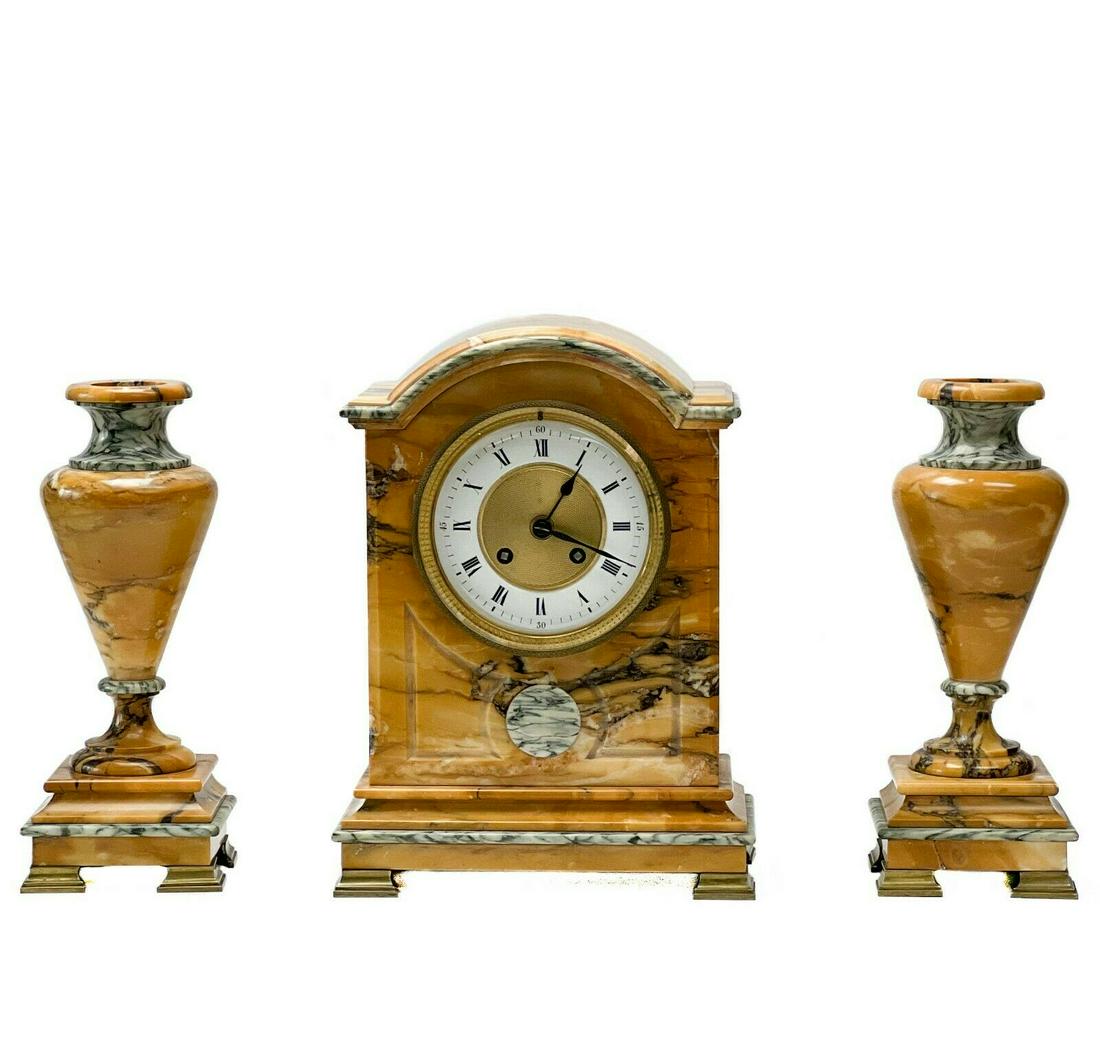 French Sienna Marble Gilt Bronze Clock Garniture: 19th century French sienna marble gilt bronze mounted 3 piece clock garniture. Set includes mantel clock and a pair of candlestick holders in the form of vases. Gilt bronze mounted feet. Clock marked