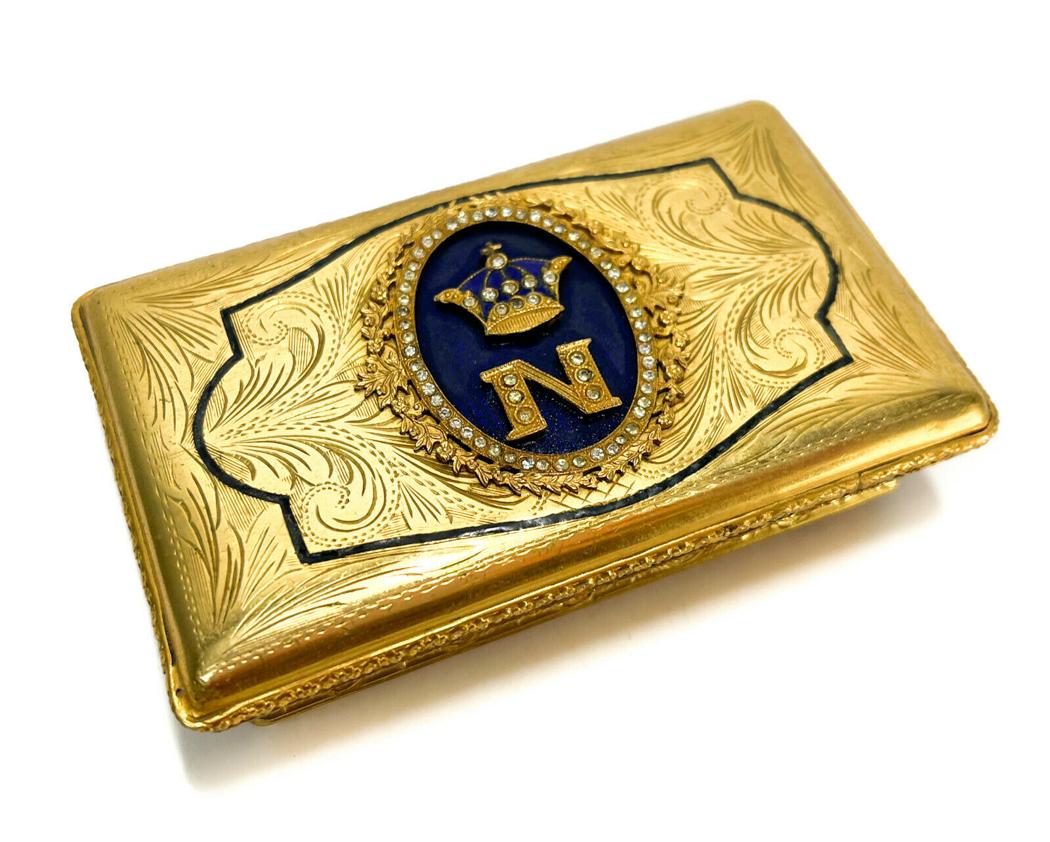 Italian Gilt Metal and Enamel Napoleonic Trinket Pill Box, circa 1930.: Italian gilt metal Napoleonic trinket pill box, circa 1930. The center of the lid depicts an applied monogram "N" with a crown adorned in faux diamonds for Napoleon Bonaparte in gilt metal and cobalt