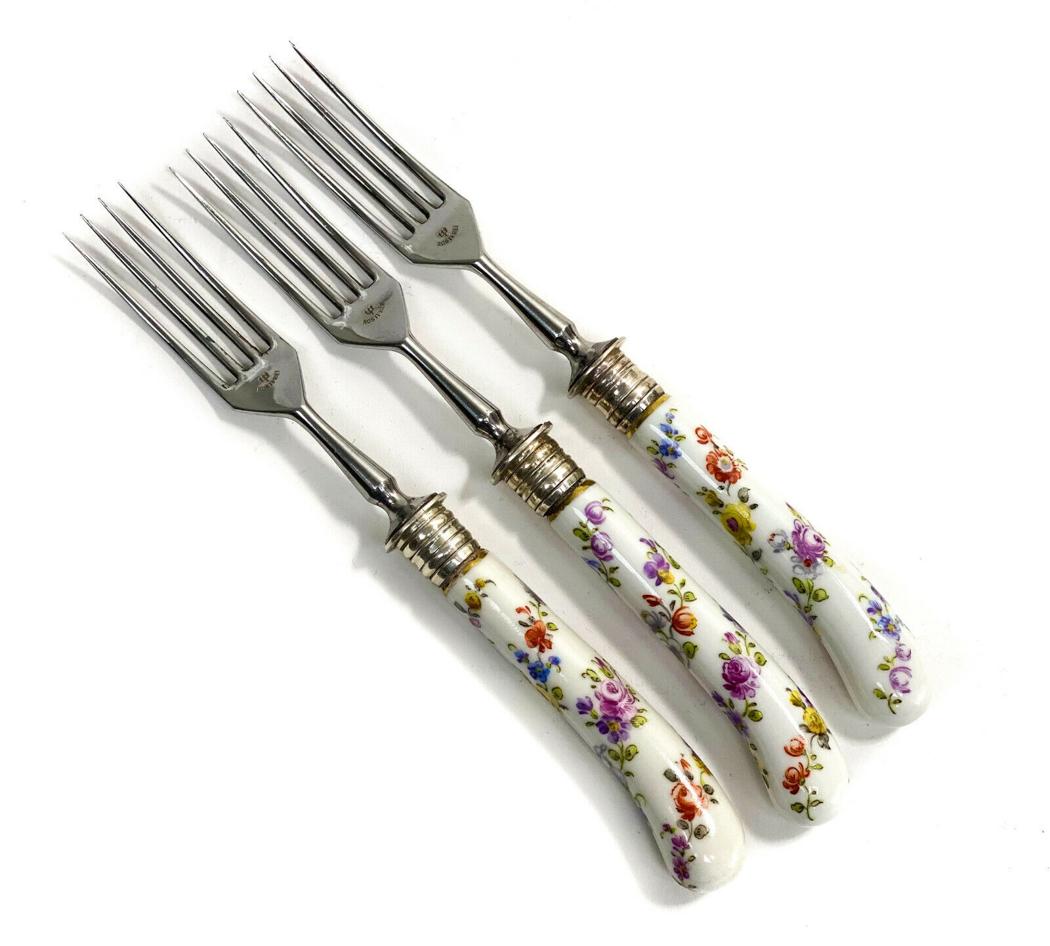 3 Rostfrei 800 Silver Porcelain Forks: 3 Rostfrei 800 silver & Dresden or Meissen porcelain forks, Early 20th Century. A white ground with hand painted floral bouquet swirls to the handles. Marked Rostfrei to the tines and 800 to the ferru