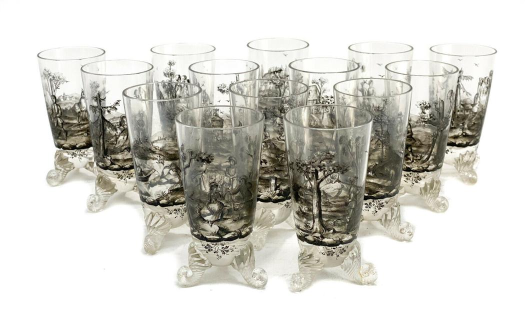 14 German Schwartzlot Style Black Enamel Wine Goblets: 14 German Schwartzlot style black enamel glass footed 4 inch wine goblets, circa 1900. Beautiful and ornate hand painted black enamel 19th Century genre scenes to the exterior. Swirled feet to the bas