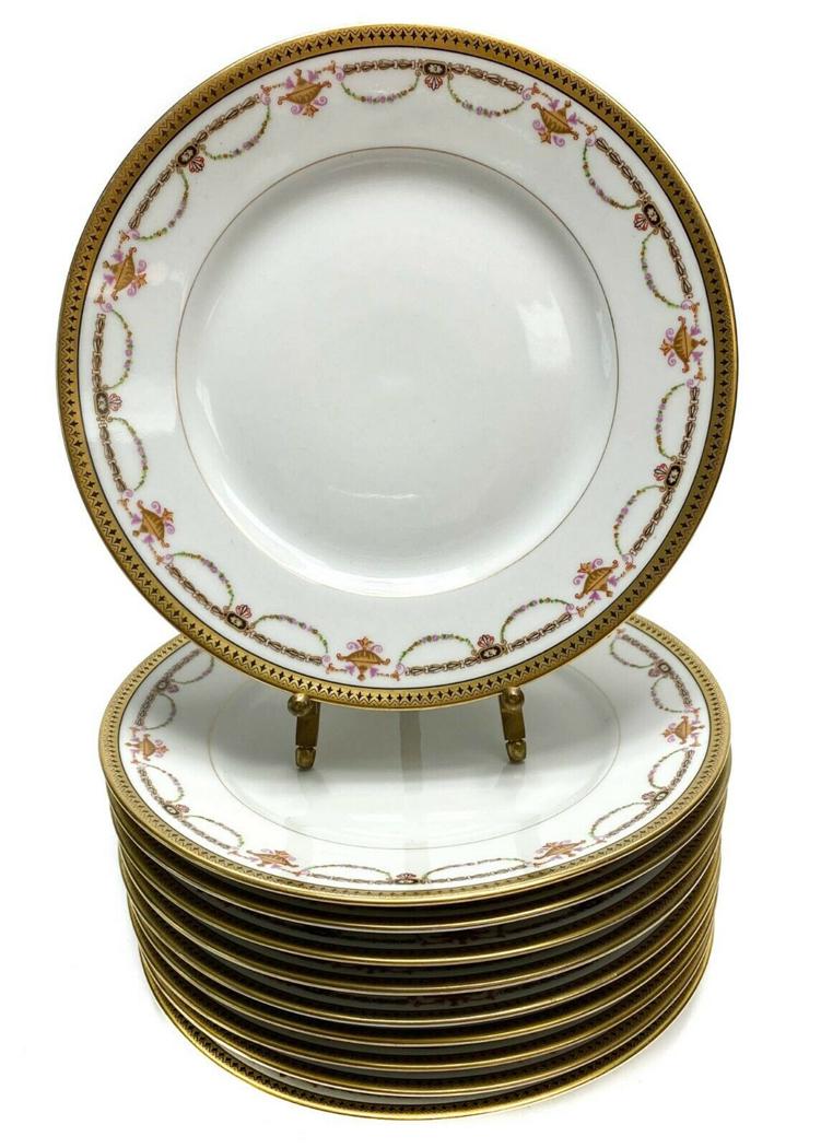 10 Bernardaud Limoges Porcelain Floral Bread Plates: 10 Bernardaud Limoges Porcelain Gilt Rimmed Bread & Biscuit Plates with Floral Swags c1910. Floral gilt swag decorations with a white ground. Weight Approx., 4 lbs Measures Approx., 6.3 in. diameter x