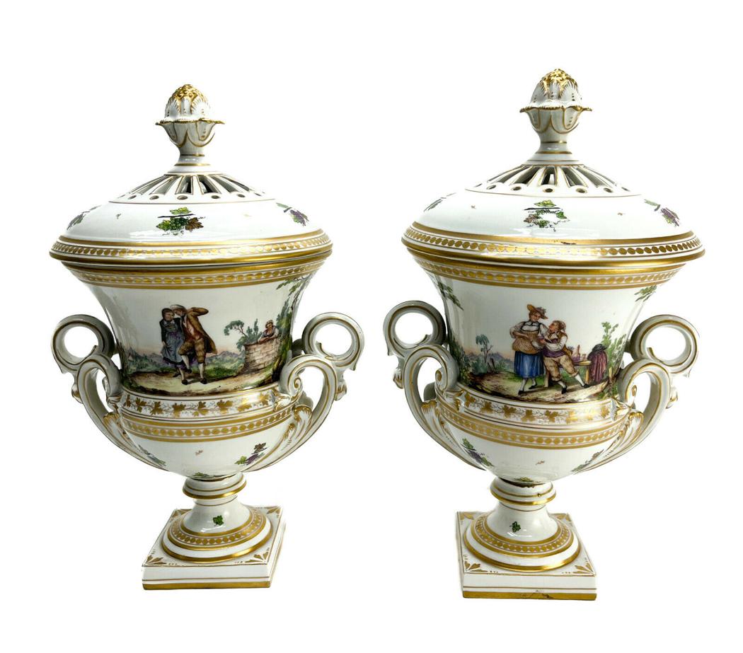 Pair Royal Vienna Austria Hand Painted Porcelain Potpurri Urns, circa 1880: Pair Royal Vienna Austria hand painted porcelain potpurri urns, circa 1880. Charming hand painted courting scenes to the central area of the urns. Gilt grape vines to the circular bands and a figural 