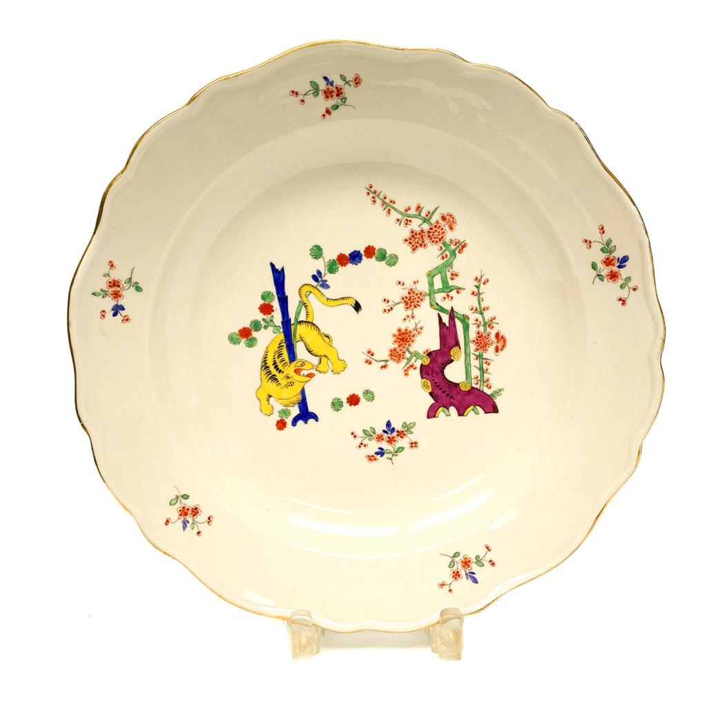 Meissen Scallop Rimmed Charger in Kakiemon Tree of Life: Meissen Germany hand painted scallop rimmed charger in Kakiemon Tree of Life, 19th Century. Vibrant hand painted lizards climbing a tree branch with floral accents. Minute firing imperfections to the 