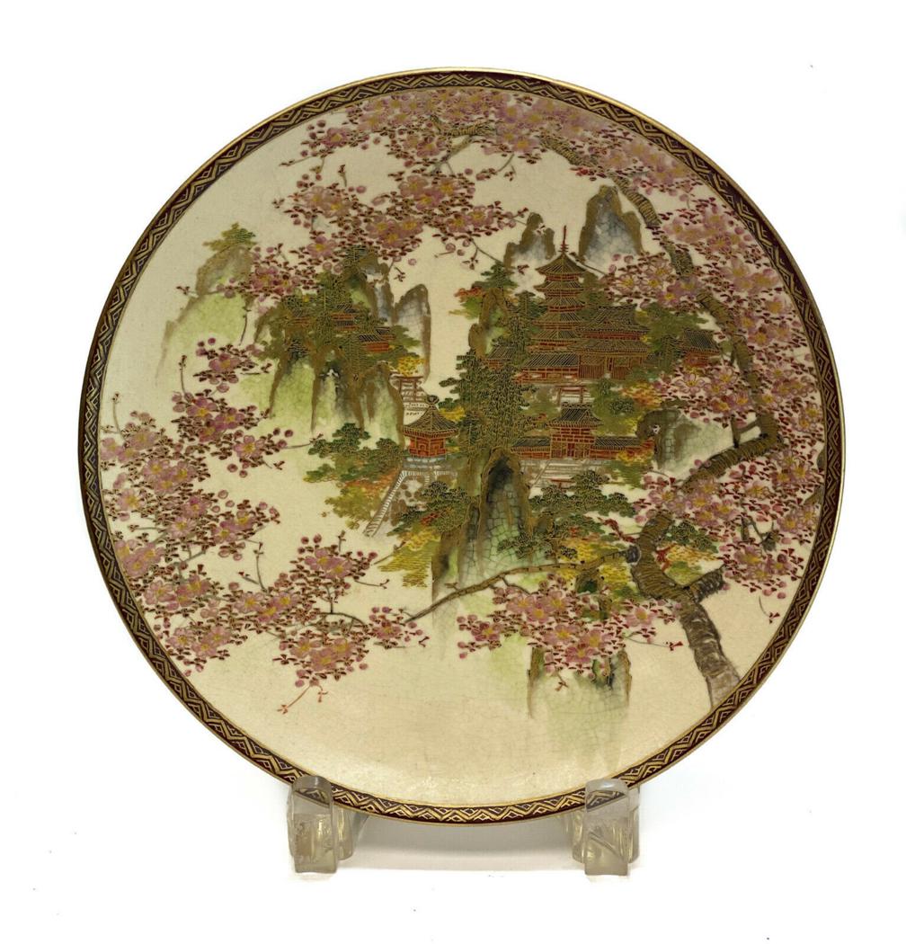 Japanese Satsuma Cabinet Plate Cherry Blossoms: Japanese hand painted Satsuma porcelain cabinet plate. Hand painted temples on a hillside with cherry blossoms around the rims. Japanese maker mark to the underside. Weight Approx., 1 lb Measures Appr