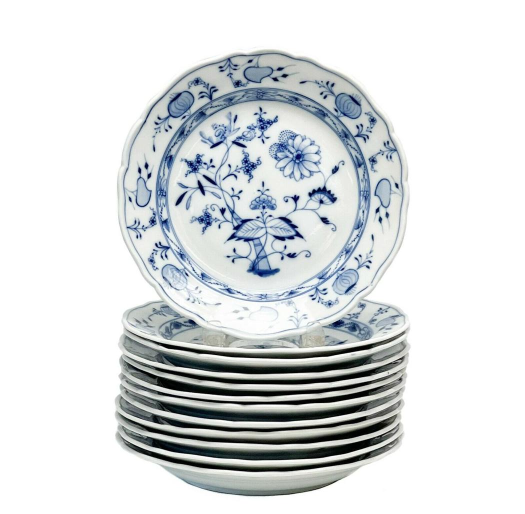 12 Meissen Germany Hand Painted Porcelain Dinner Plates in Blue Onion: 12 Meissen Germany hand painted porcelain dinner plates in Blue Onion. Blue florals and onion decoration throughout. Underside with Meissen marks and impressed Meissen. Weight Approx., 13 lbs Measures