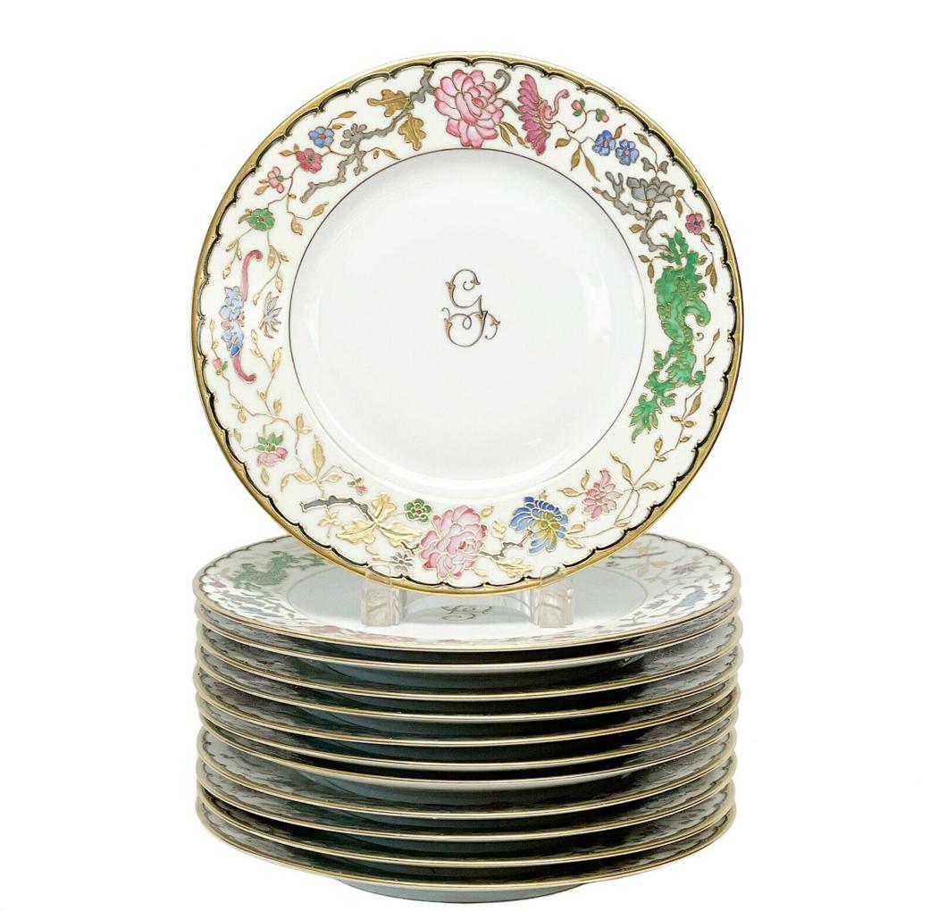 12 Vintage Czech Gilt & Enamel Florals Porcelain Dinner Plates: 12 vintage Czechoslovakian gilt & enamel porcelain dinner plates. A white ground with raised gilt and colorful enamel florals to the edge. Gilt scalloped decoration to the rim, center with gilt single