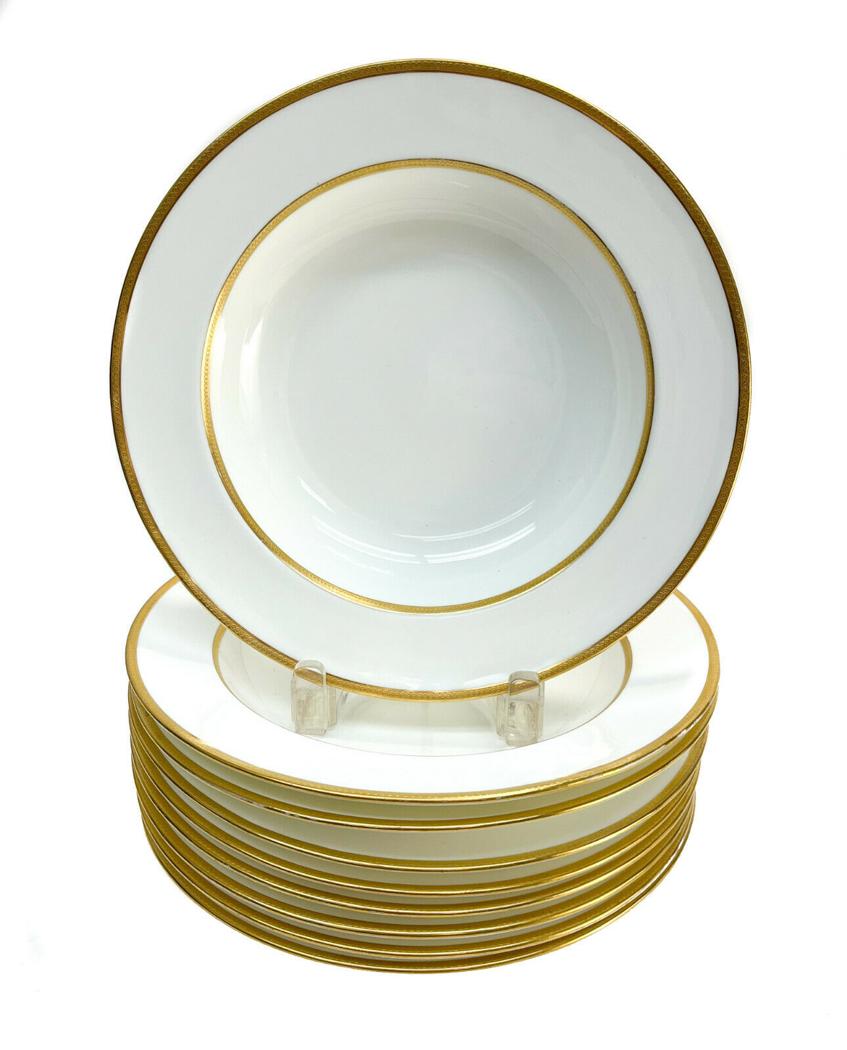 9 Minton England Porcelain and Gilt Rimmed Soup Bowls, circa 1900: 9 Minton England porcelain and gilt rimmed soup bowls, circa 1900. Gold bands with embossed circular garland. Minton England marks to the underside. Weight Approx., 8 lbs Measures Approx., 9.5 inches 