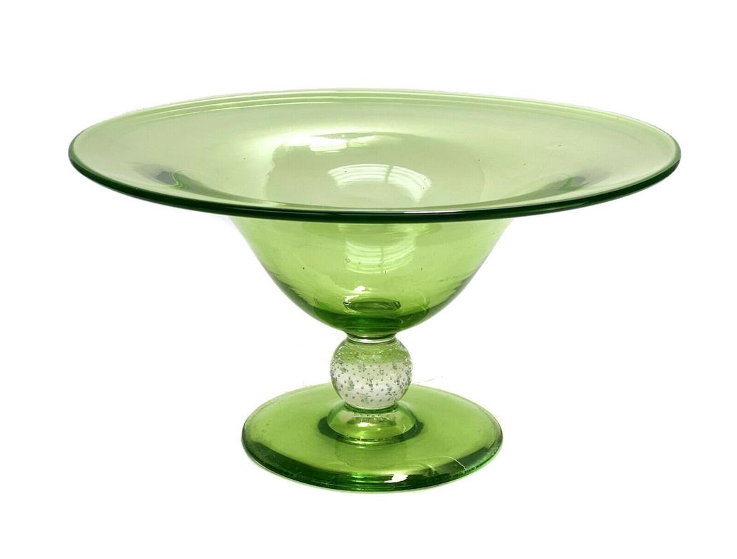 Pairpoint Green Glass Centerpiece Bowl, Controlled Bubble Stem: Pairpoint green glass centerpiece bowl. Controlled bubble to the stem. Unmarked, but is undoubtedly Pairpoint. Measures Approx.,12.25 inches diameter x 6.5 inches tall. Domestic Shipping: $65