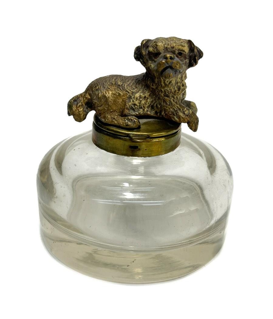 Austrian Cold Painted Bronze Dog Round Glass Inkwell, circa 1920: Austrian cold painted bronze dog round glass inkwell, circa 1920. The finial depicts a reclining pug dog. Unmarked. Weight Approx., 1.5 lbs Measures Approx., 3.75 inches diameter x 4 inches tall