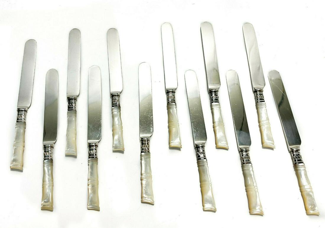 12 Mother of Pearl Handled Knives: 12 American steel and Mother of Pearl fruit or dessert knives, circa 1920. Mother of Pearl carved to resemble bamboo. Silver plate ferrules, blades marked Duhme & Co. Cincinnati. With rolled flatware