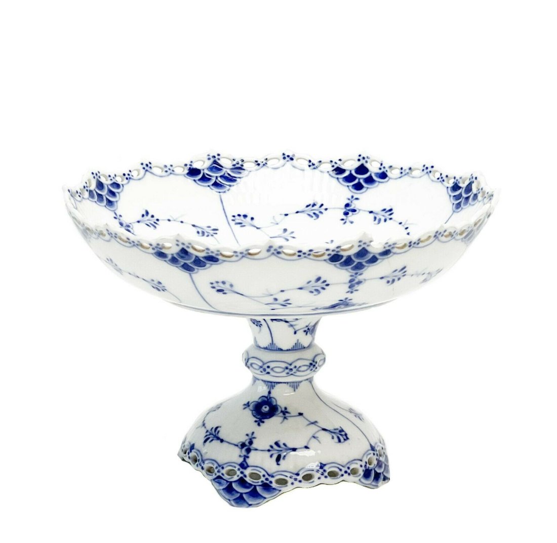 Royal Copenhagen Denmark Porcelain Tazza Blue Fluted Full Lace Border #1020: Royal Copenhagen Denmark porcelain tazza blue fluted full lace border #1020. A white ground with blue florals, reticulated full lace edge. Royal Copenhagen marks to the underside of base and bowl. Bow