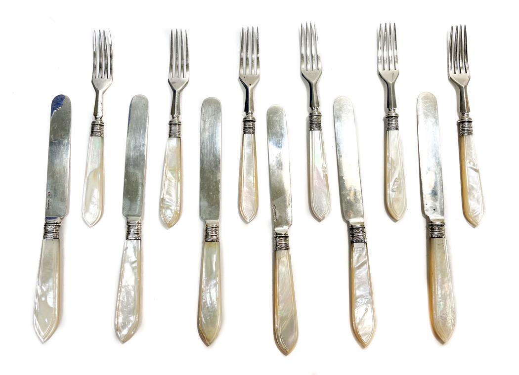 Russian 84 Silver Fish Fork and Knives: 12 Russian 84 Silver and Mother of Pearl handled Fish Forks and Knives with hallmarks for Mikhail Grachev . Ribbed bolsters. Marked to the blades and tines with imperial warrant hallmarks. Weight Appr