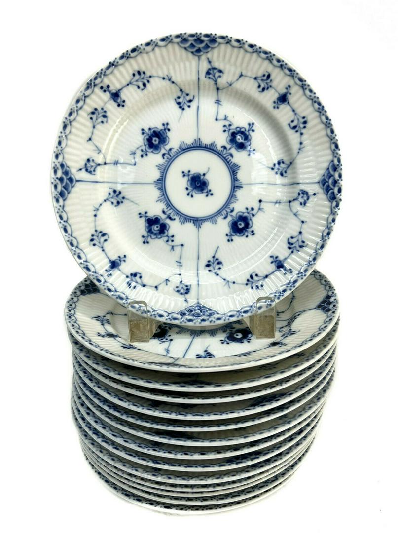 14 Royal Copenhagen Salad Plates in Fluted Half Lace #573: 14 Royal Copenhagen Denmark porcelain salad plates in fluted half lace #573. Blue florals throughout. Royal Copenhagen mark to the underside with various date marks. 7 with a scratch through the mark-