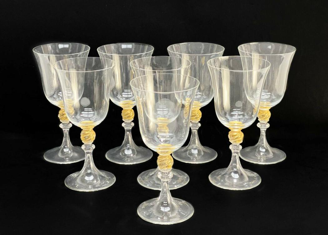 8 Venetian Glass Stemware Gold Fleck Wine Glasses: 8 Venetian Glass stemware gold fleck wine glasses. Twisted ball stem with applied gold fleck. Weight Approx., 3 lbs Measures Approx., 3.5 inches diameter x 7.25 inches tall. Domestic Shipping: $75