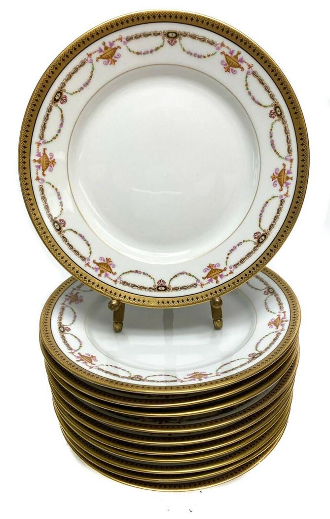 10 Bernardaud Limoges Porcelain Gilt Rimmed Plates: 10 Bernardaud Limoges Porcelain Gilt Rimmed 8.3" Plates with Floral Swags c1910. These plates could be used for lunch, dessert or salad. Floral gilt swag decorations with a white ground Weight Approx.