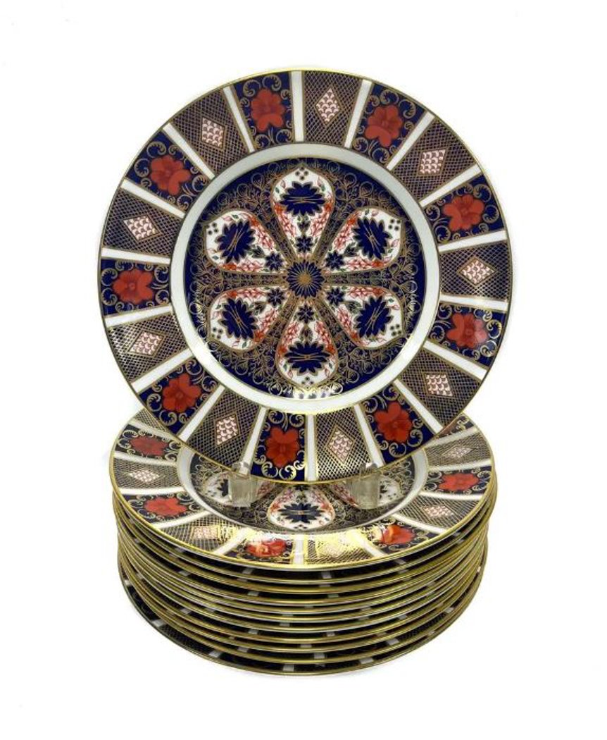 12 Royal Crown Derby England Porcelain Dinner Plates in Old Imari: 12 Royal Crown Derby England Porcelain dinner plates in Old Imari. Beautifully decorated in blue, red, and gold floral and geometric designs. "Imari" typically feature designs and colors based on porc