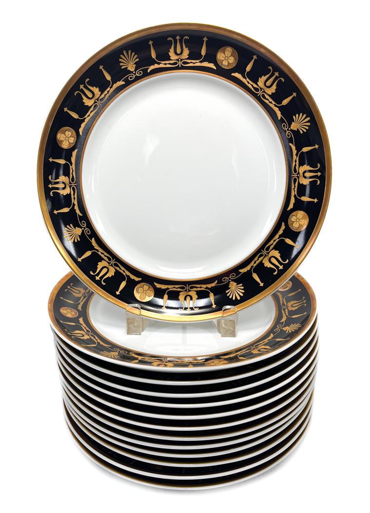 14 Tiffany & Co. Mottahedeh Porcelain Dinner Plates Black and Gold.: 14 Tiffany & Co. Mottahedeh Porcelain Dinner Plates Black and Gold. Black ground rim with gold town florals and swag motifs. Marked Tiffany & Co. Mottahedeh Made in Portugal to underside. Weight Appro