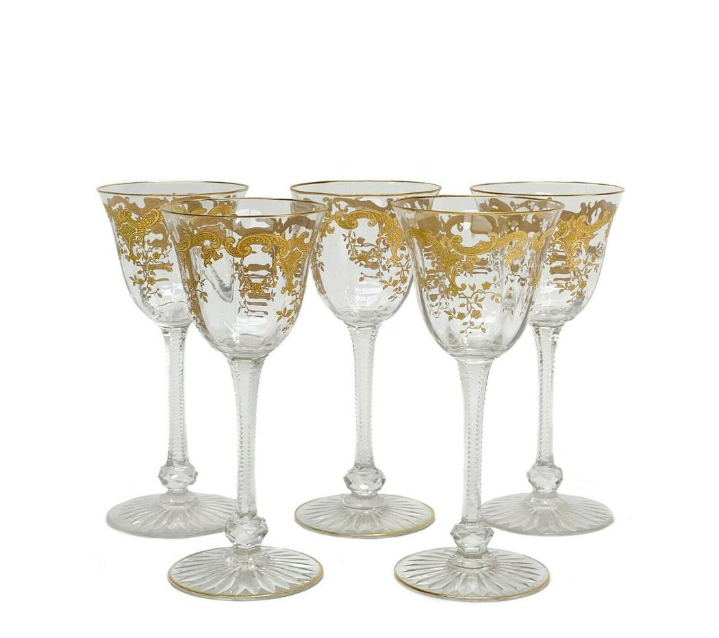 5 Saint Louis Massenet Clear Gold Encrusted Wine Glasses: 5 St Louis Massenet Clear gold encrusted sherry glasses. Gold encrusted foliate and floral design to bowls with gilt accents, cut glass knobbed stem, and a star cut foot. Weight Approx., 1.5 lbs Measu