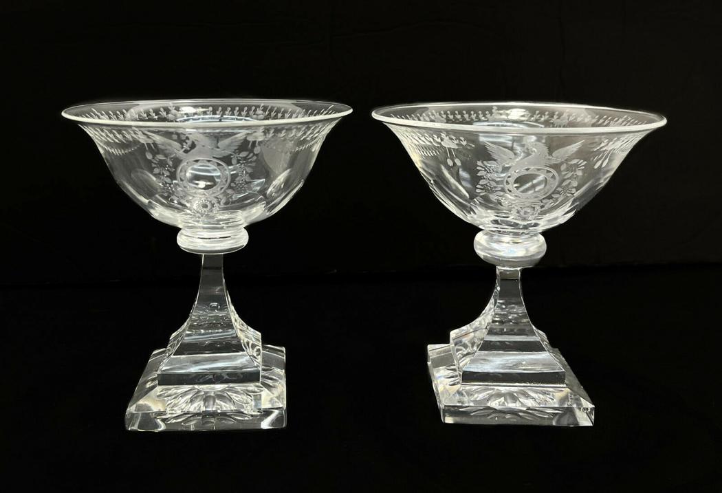 Pair Steuben Acid Etched Cut Glass Wine Goblets in Strawberry Mansion: Pair Steuben acid etched cut glass wine goblets in Strawberry Mansion. Acid etched cut eagles and wreaths to the center. Square bases. Marked Steuben to the underside of each. Weight Approx., 1 lbs Me