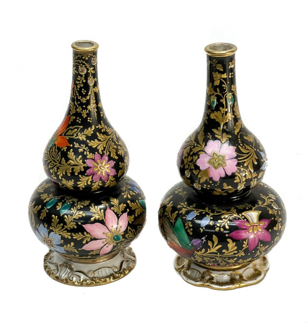 Pair Jacob Petit French Porcelain Gourd Shaped Vases: Pair Jacob Petit French porcelain gourd shaped vases, 19th Century. A black ground with gold encrusted leaves with multi-colored hand painted birds flowers throughout. Artist signed "JP" to the unders