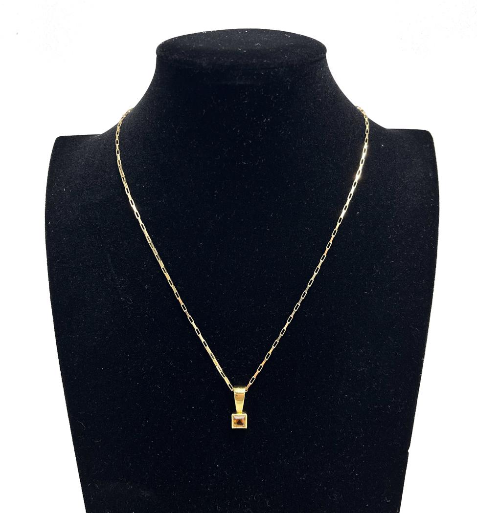 14k Yelow Gold and Citrine Pendant Necklace: 14k Yelow Gold and Citrine Pendant Necklace. Square Citrine pendant to center. Marked "14k" to clasp. Weight Approx., 5.74 grams Measures Approx., 17.75 inches length Domestic Shipping: $20