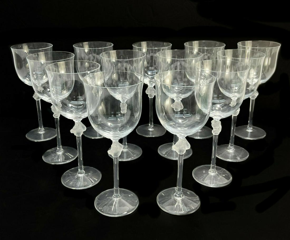 12 + 1 Lalique France Frosted Clear Glass Burgundy Wine Goblets in Roxane: 12 plus a spare Lalique France frosted & clear crystal glass burgundy wine goblets in Roxane, Signed. Each with frosted detail of two intertwined figures to the stem and scalloped beveled base. Signed