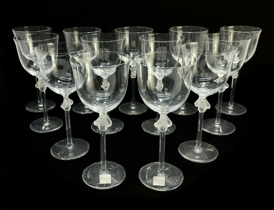 12 + 1 Lalique France Frosted Clear Glass Bordeaux Wine Goblets in Roxane: 12 plus a spare Lalique France frosted & clear crystal glass bordeaux wine goblets in Roxane, Signed. Each with frosted detail of two intertwined figures to the stem and scalloped beveled base. Signed