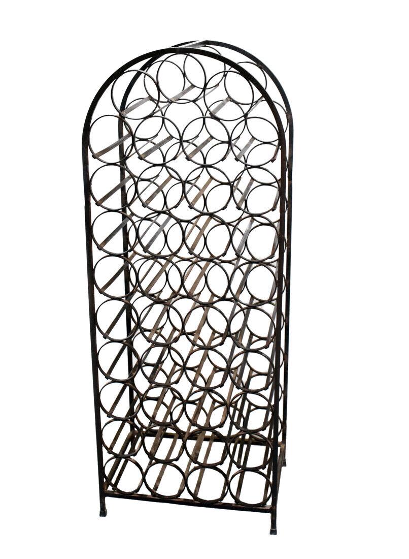 Vintage Wrought Iron Arched Wine Bottle Rack - No Reserve: Vintage wrought iron wine bottle rack, arched form. Weight Approx., 100 lbs. Approx. Measurements: 44 inches height x 16.75 inches width x 12 inches deep.