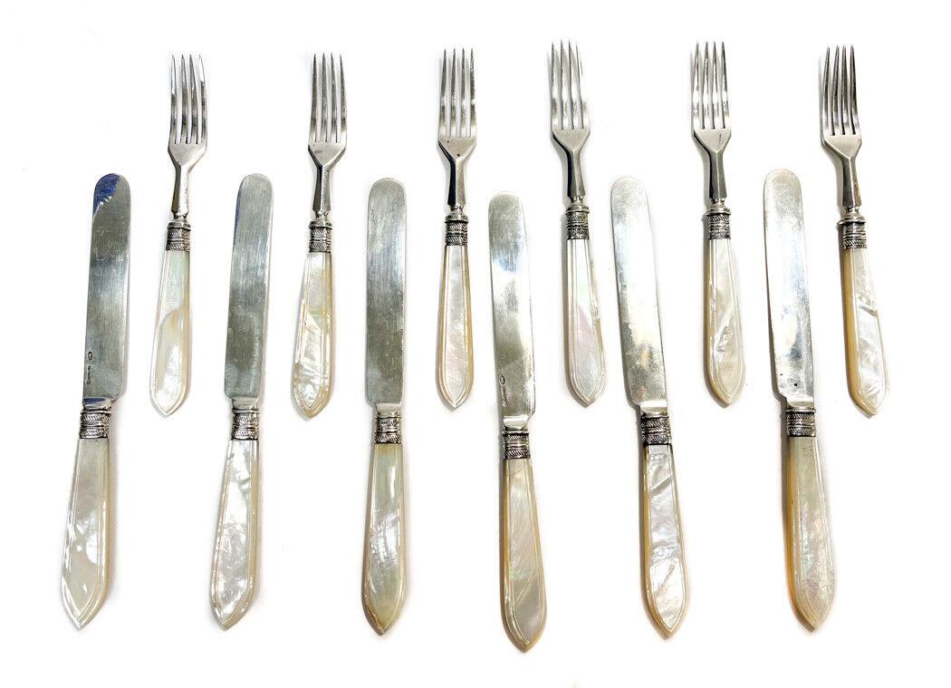 Russian 84 Silver Fish Fork and Knives: 12 Russian 84 Silver and Mother of Pearl handled Fish Forks and Knives with hallmarks for Mikhail Grachev . Ribbed bolsters. Marked to the blades and tines with imperial warrant hallmarks. Weight Appr