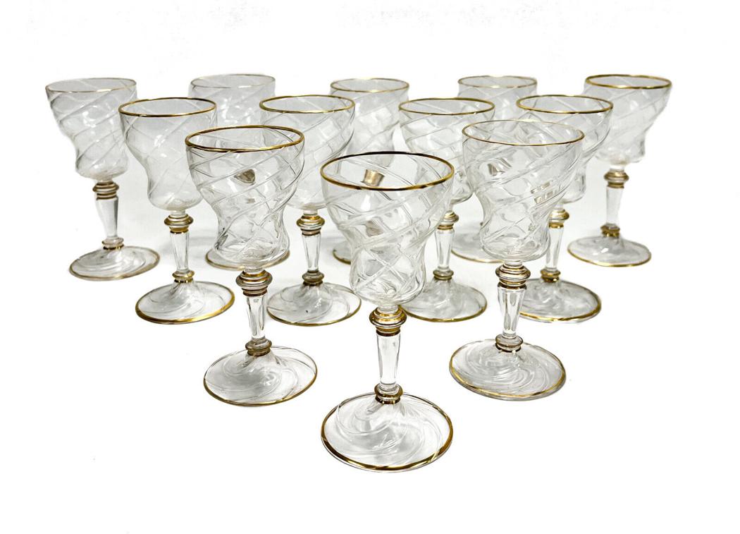12 Lobmeyr Germany Swirled Glass 4.75 2 ounce Wine Goblets, Gilt Rims: 12 Lobmeyr Germany swirled glass 2 ounce goblets, circa 1900. A continuous swirl pattern from the base to the stem and up to the bowl. With Gilt highlights. Various goblets to the underside with Lobme