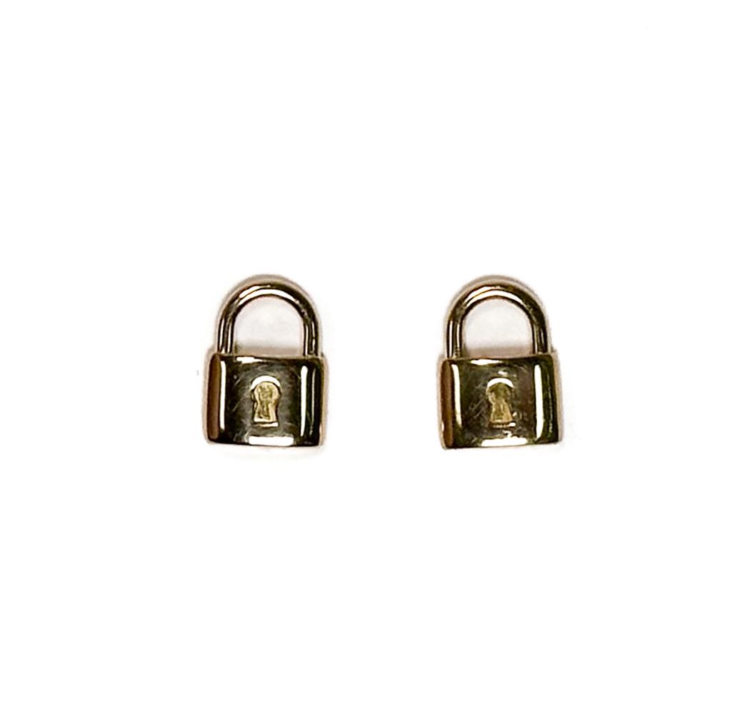 Tiffany & Co. 18k Rose Gold Lock Stud Earrings: Tiffany & Co. 18k Rose Gold Lock Stud Earrings. Signed "T&CO 750" to the stud backings. Weight Approx., 1.88 grams Measures Approx., 0.3 inches x 0.23 inches Domestic Shipping: $20