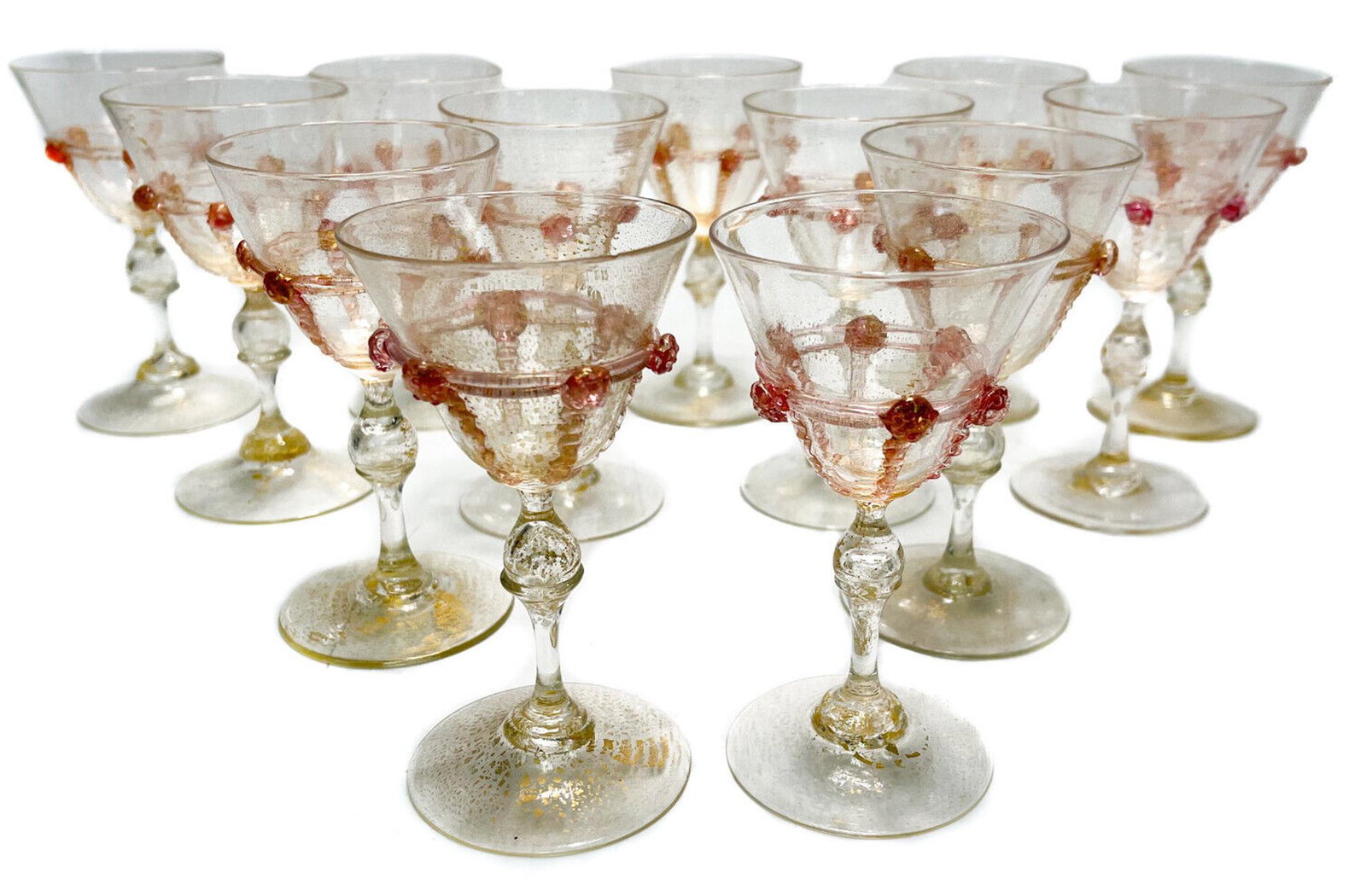 12 + 1 Salviati Cranberry Red Art Glass Wine Goblets: 12 + 1 Venetian cranberry red art glass wine goblets. Applied tendrils to the exterior bowl. Gold flecks throughout. Pontil underside. Attributed to Salviati. Weight Approx., 2 lbs Measures Approx., 2