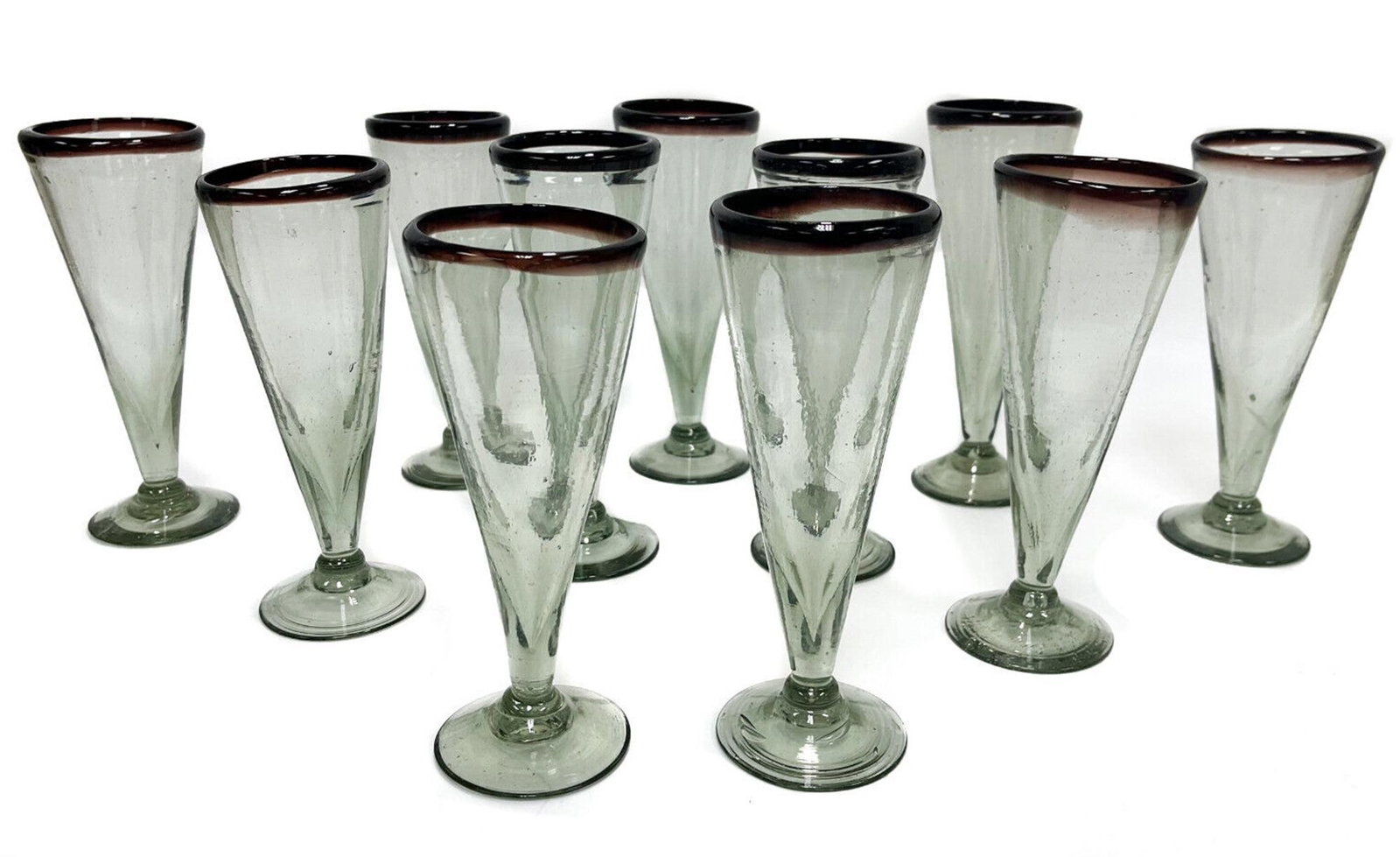 11 Italian Hand Blown Green and Amethyst Glass Dessert Flutes, Mid Century: 11 Italian hand blown dessert flutes, Mid Century. Faint green to the body with amethyst to the rims. Rough pontils to the underside base. Weight Approx., 8 lbs Measures Approx., 3 inches diameter x 7