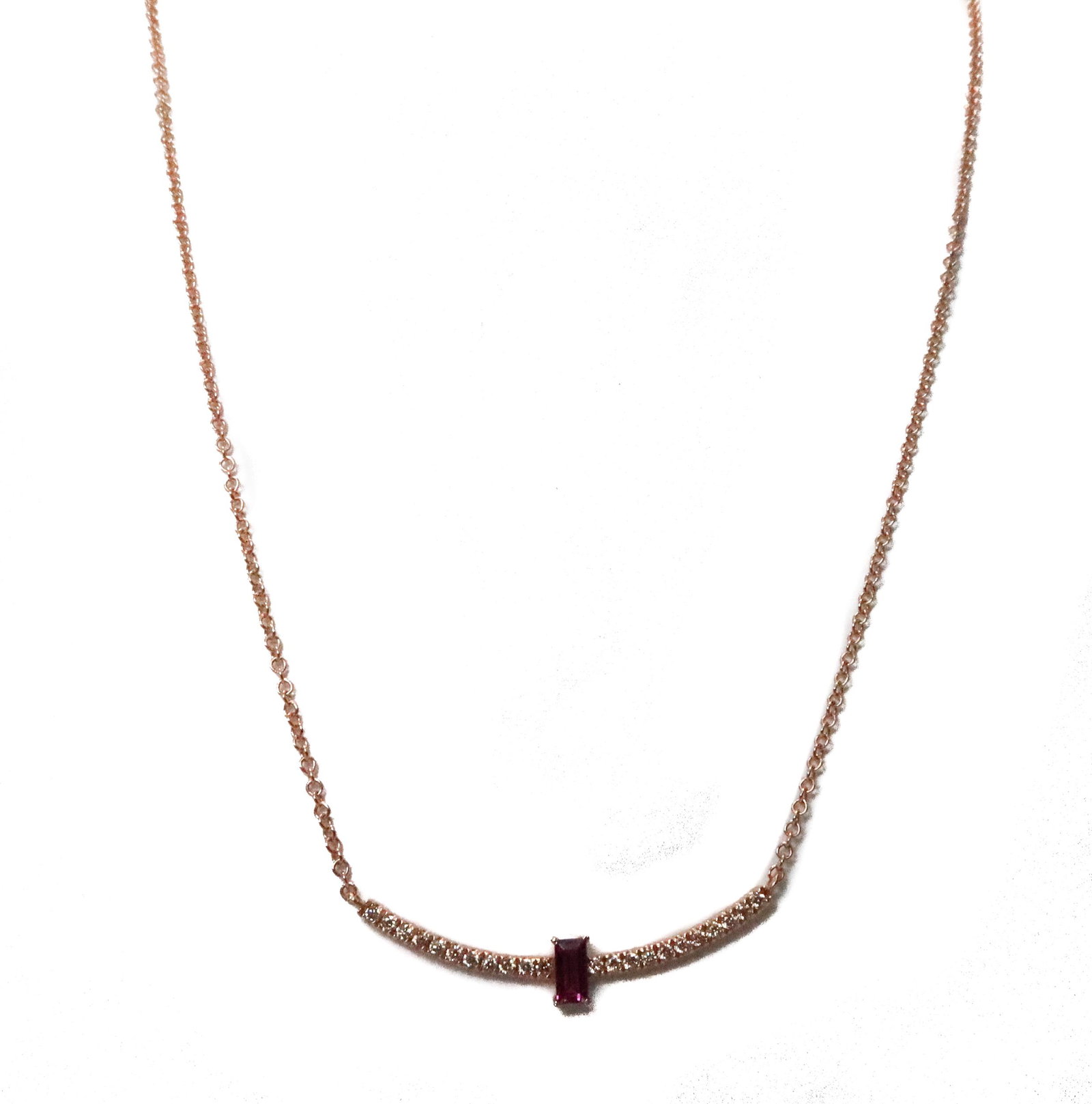 14k Rose Gold Diamond and Pink Tourmaline Necklace: 14k Rose Gold Diamond and Pink Tourmaline Necklace. 22 brilliant round cut diamonds weighing approximately 0.14 carats with an emerald cut pink tourmaline to center. Marked "585" to clasp and "14k CL"