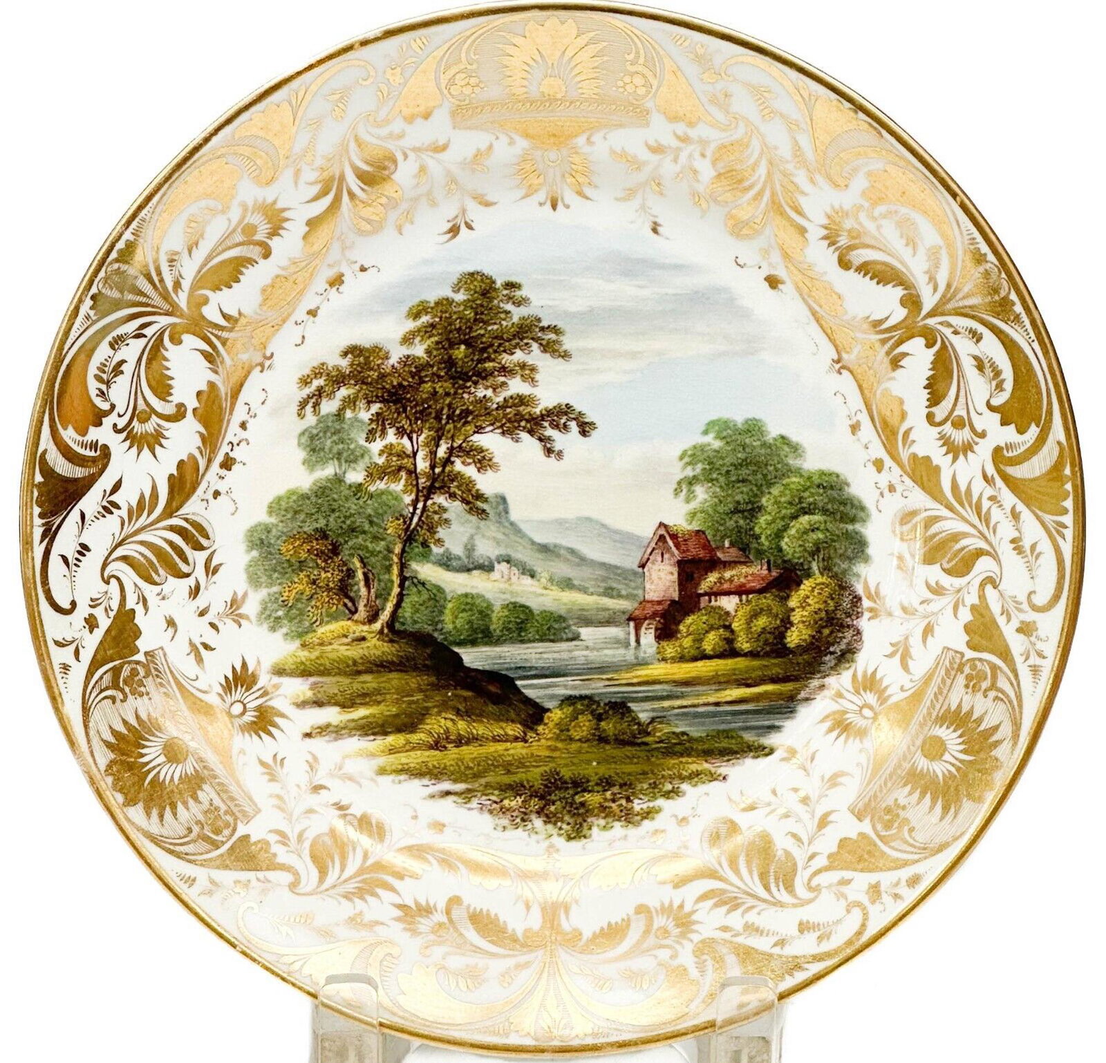 Royal Crown Derby Hand Painted Porcelain Cabinet Plate "In Cumberland" c. 1800: Royal Crown Derby England hand painted porcelain cabinet plate, circa 1800. A hand painted landscape scene with a house to the center. Gilt decoration to the edge. Underside titled "In Cumberland" and