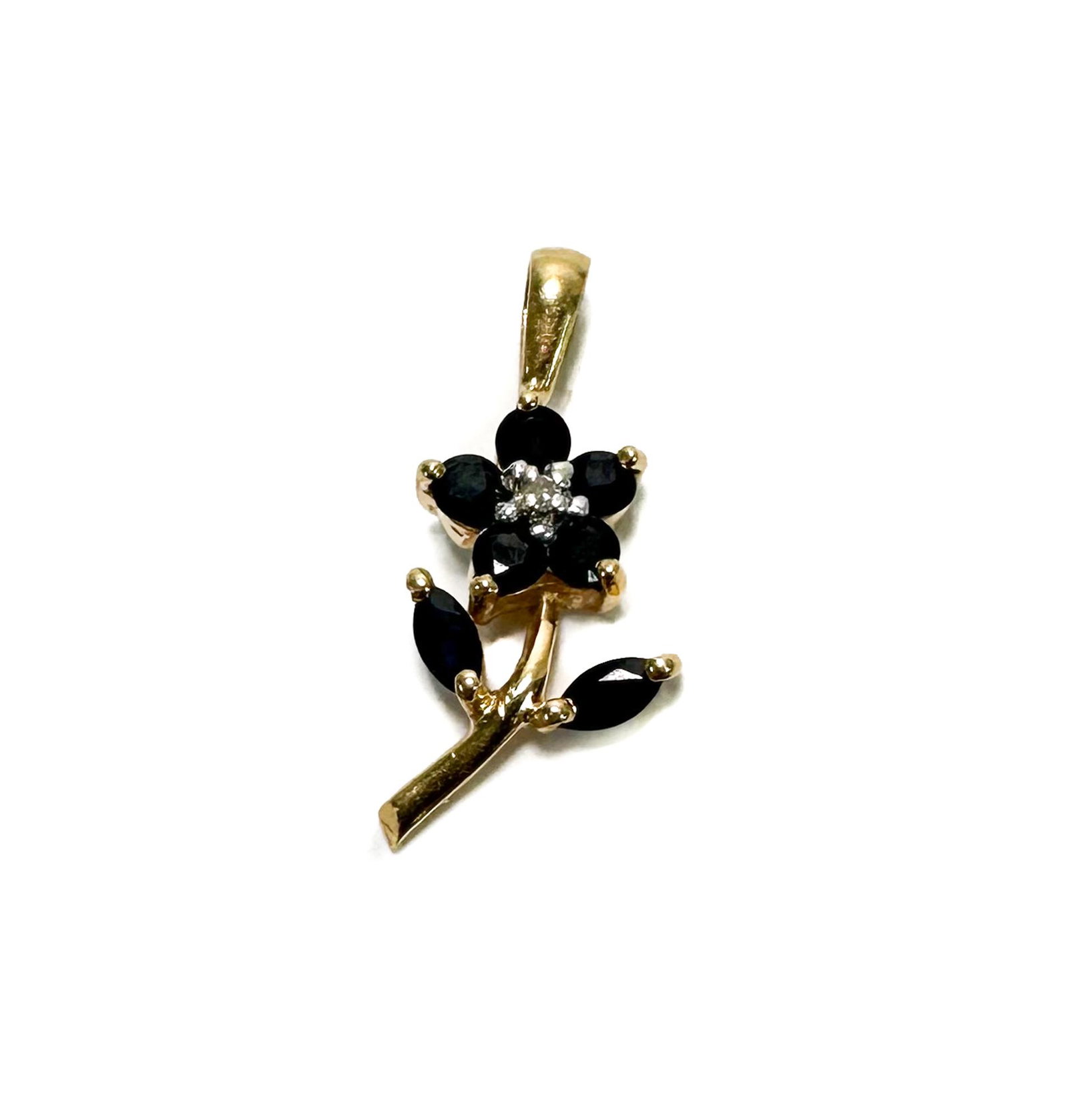14k Yellow Gold Sapphire and Diamond Flower Pendant: 14k Yellow Gold Sapphire and Diamond Flower Pendant. Blue sapphires to the petals and leaves with a diamond center. Unmarked, but tests for 14k gold. Weight Approx., 1.25 grams Measures Approx., 0.75 