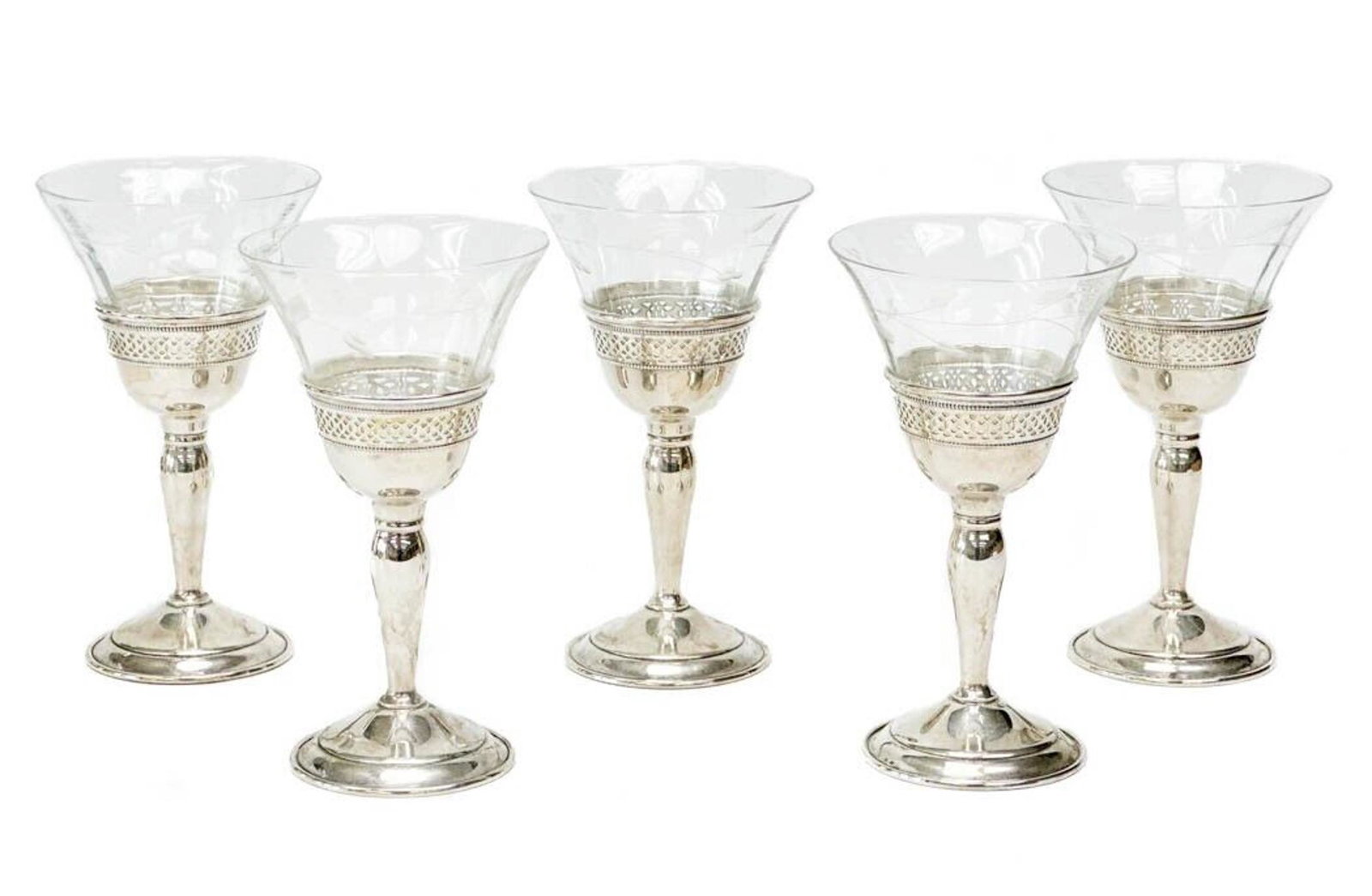 5 Redlich & Co. American Sterling Silver and Glass Wine Glasses, c. 1920: 5 Redlich & Co. American sterling silver and glass wine glasses, circa 1920. Sterling silver bases with pierced decoration to the rim. Redlich & co. sterling marks to the base. Clear glass bowls with 