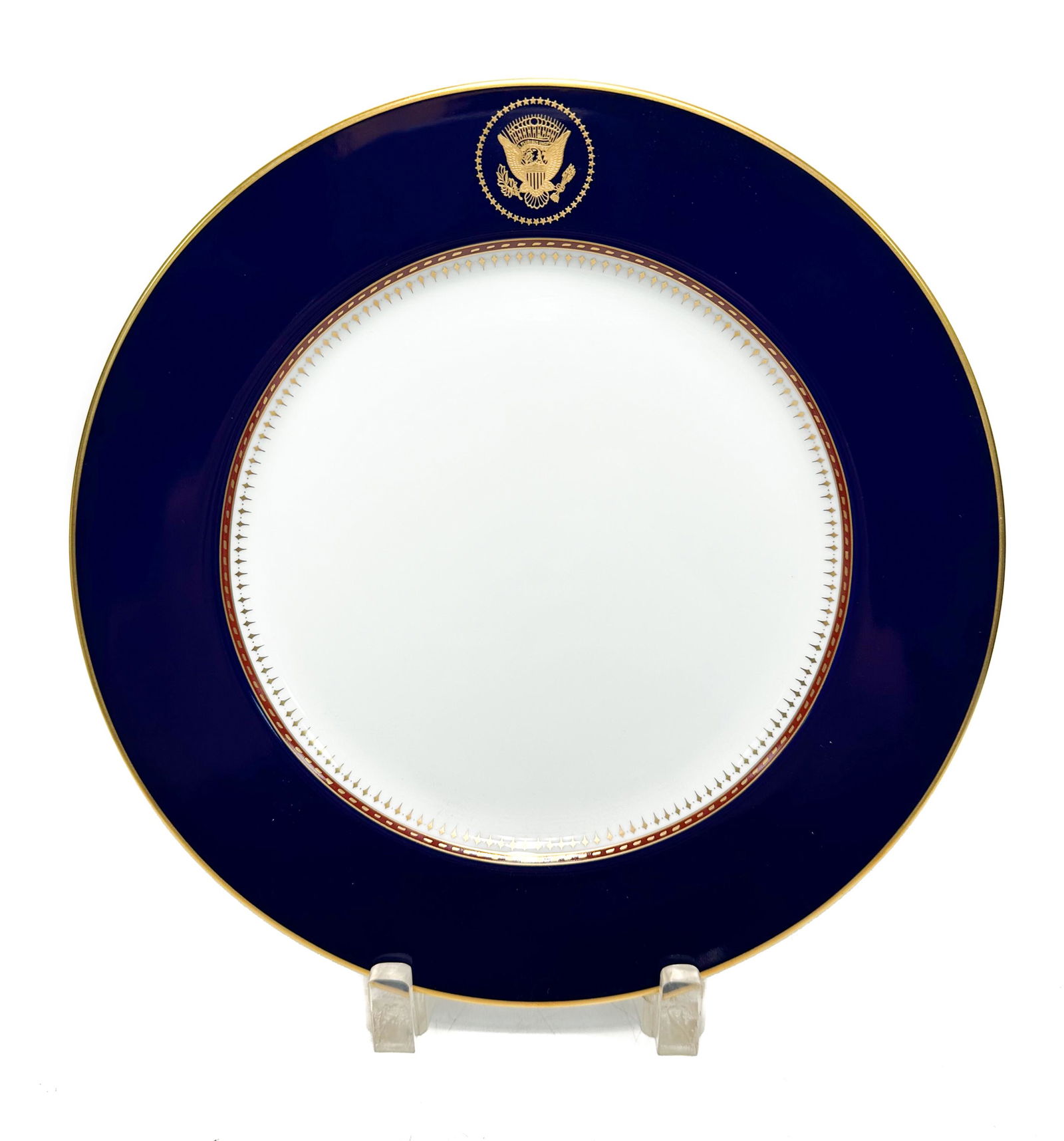Fitz and Floyd Reagan White House Dinner Plate: Fitz and Floyd Fine China porcelain White House Service dinner plate by Robert C. Floyd, 1983. A cobalt blue ground and gilt Great Seal of the United States to top central rims. Gilt accents to the ed