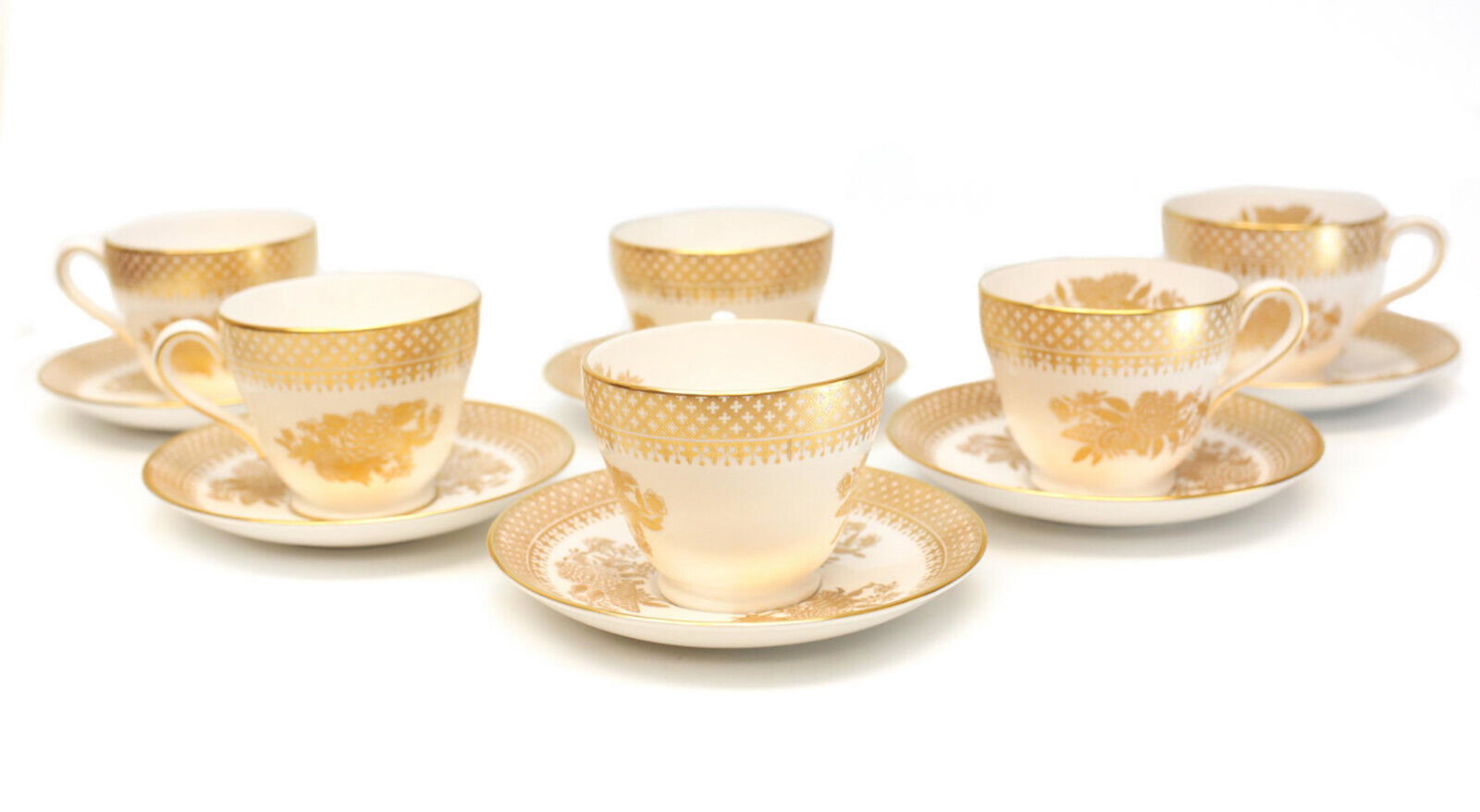 6 Spode Porcelain Gilt Cup & Saucers in Golden Clipper: 6 Spode England bone china porcelain gilt cup & saucers in Golden Clipper. Gilt floral bouquets decorations throughout. Cross designs around the rim. Spode mark to the underside. Weight Approx., 4 lbs