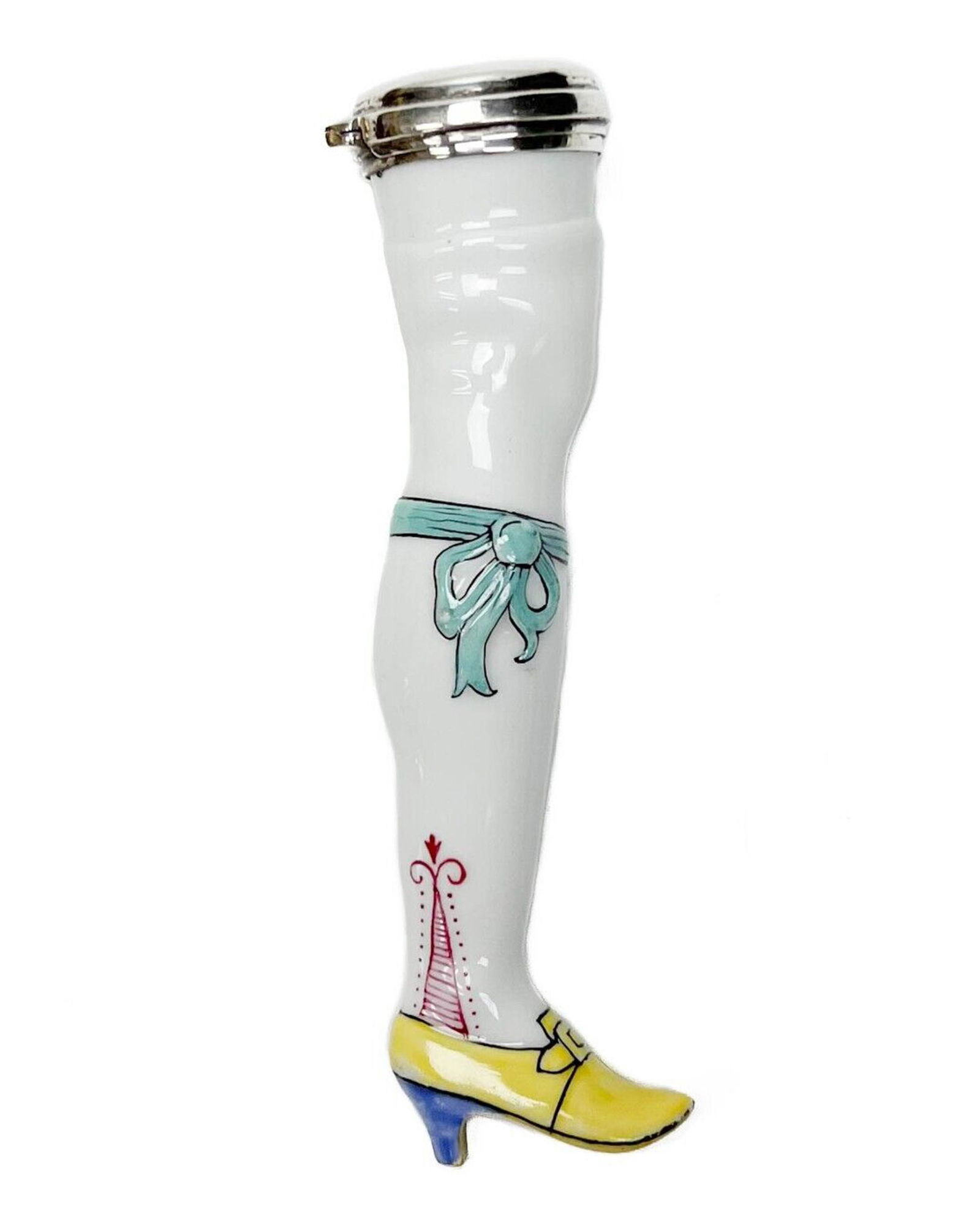 Continental Porcelain and Sterling Silver Figural Lady's Leg Needle Case: Continental porcelain and sterling silver figural lady's leg needle case, 1st quarter 20th century.. Figural leg with stocking, blue ribbon garter, yellow shoe with blue heel. Silver cap marked 925 un